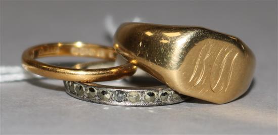 A 22ct gold wedding band, an 18ct gold signet ring and a marcasite ring.